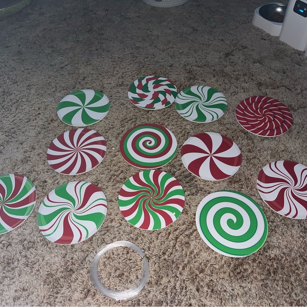 Festive Swirl candies string and hang from ceiling . Swirls on both sides.